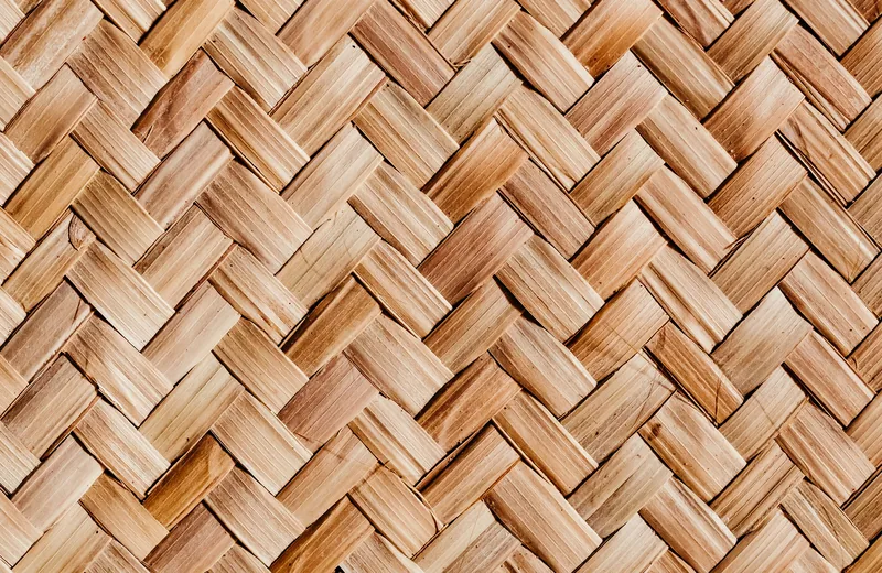 Close detail of a herringbone weave in natural fibre