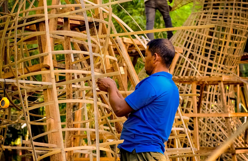 Large woven frames being built by hand in an open workshop